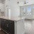 a kitchen with white cabinets