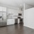a kitchen with white cabinets
