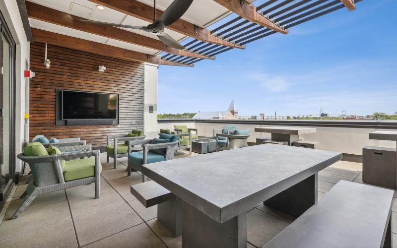 Cutting-edge amenities at your fingertips a patio with a table and chairs
